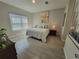 Inviting bedroom with natural light, tile flooring, and a calming color scheme that promotes relaxation at 125 Inconnu Ct, Poinciana, FL 34759