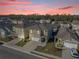 Aerial view of a modern residential neighborhood with well-maintained lawns and uniform two-story homes at 1368 Berry Ln, Davenport, FL 33837