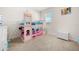 Charming bedroom featuring a princess-themed bunk bed, perfect for imaginative play and restful nights at 1368 Berry Ln, Davenport, FL 33837