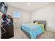 Serene bedroom with a plush bed, neutral walls, and a view from the window, creating a peaceful retreat at 1368 Berry Ln, Davenport, FL 33837