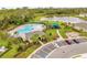 A gorgeous community pool is easily accessible with nearby parking and lush landscaping at 1368 Berry Ln, Davenport, FL 33837