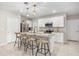 Modern kitchen featuring white cabinets, stainless steel appliances, granite countertops, and a central island at 1368 Berry Ln, Davenport, FL 33837