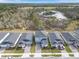 Community aerial view of homes, landscaping, and wetland preserve at 139 Aces High Ln, Davenport, FL 33896