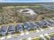 Aerial view of homes with a golf course in the background and lush landscaping at 139 Aces High Ln, Davenport, FL 33896