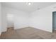 Bright and airy bedroom with neutral carpet and view into closet at 139 Aces High Ln, Davenport, FL 33896