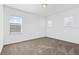 Bright and airy bedroom featuring neutral carpeting and several windows that provide ample natural light at 139 Aces High Ln, Davenport, FL 33896