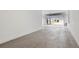 Clean, spacious, open two-car garage with bright epoxy floor at 139 Aces High Ln, Davenport, FL 33896
