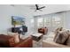 Comfortable living room featuring recessed lighting, tile flooring, and large windows at 139 Aces High Ln, Davenport, FL 33896