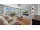Inviting living room with large windows, neutral tones, and a sleek fireplace at 139 Aces High Ln, Davenport, FL 33896