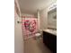 Bathroom with a shower curtain, sink, and toilet at 144 Bella Dr, Davenport, FL 33837