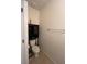 Bathroom featuring a toilet, towel rack, and storage at 144 Bella Dr, Davenport, FL 33837