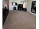 Large living room with a TV, desk area, and full-length mirror at 144 Bella Dr, Davenport, FL 33837