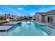 Beautiful backyard pool and spa surrounded by ample deck space and cozy covered lounge area at 1464 Howland Blvd, Deltona, FL 32738