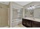 This bathroom features a bathtub, a large mirror, and a well lit vanity at 1464 Howland Blvd, Deltona, FL 32738