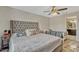 This bedroom features a queen bed and single bed with tile flooring at 1464 Howland Blvd, Deltona, FL 32738