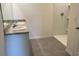 Bathroom featuring double sinks with countertop, a shower and tile flooring at 1827 Silverbell Loop, Haines City, FL 33844