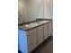 Bathroom featuring double sinks with countertop and cabinets at 1827 Silverbell Loop, Haines City, FL 33844