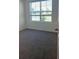 Cozy bedroom featuring a window with blinds and neutral colored walls at 1827 Silverbell Loop, Haines City, FL 33844