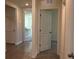 Hallway featuring tile flooring, leading to other areas of the home at 1827 Silverbell Loop, Haines City, FL 33844