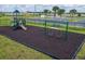 Community playground featuring modern play equipment, swings, and a safe, rubberized surface for children at 1827 Silverbell Loop, Haines City, FL 33844