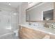 This bathroom features double sinks, a modern vanity, and a glass-enclosed shower at 194 Aidans Lndg, Haines City, FL 33844