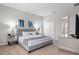 This bedroom offers a plush, upholstered bed with mirrored nightstands and modern decor at 194 Aidans Lndg, Haines City, FL 33844