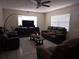 Living room featuring tiled floor, ceiling fan, and comfortable seating arrangement at 2227 Virginia Dr, Kissimmee, FL 34741