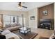 Bright living room with sliding glass doors to the lanai, comfortable seating, and a neutral color palette at 226 Bailey Cir, Davenport, FL 33897