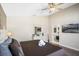 Bright main bedroom with a ceiling fan, and an ensuite bathroom at 226 Bailey Cir, Davenport, FL 33897