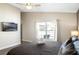 Comfortable bedroom with a ceiling fan, a TV, and a view of the pool through the window at 226 Bailey Cir, Davenport, FL 33897