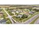 Aerial view of a home with a large lawn in a suburban neighborhood at 2462 Albany Dr, Kissimmee, FL 34758