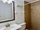 Bathroom featuring a vanity with sink, a toilet, a shelf, a towel rack, and a tiled shower at 2464 Harbour Way, Winter Park, FL 32792