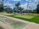 Playground area with putting green and shuffleboard in a well maintained community space at 2464 Harbour Way, Winter Park, FL 32792