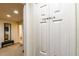 Hallway leading to a bathroom with a view of a towels closet at 2725 Coupe St, Kissimmee, FL 34746