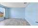 Calming blue bedroom featuring tile flooring and a window offering natural light at 2938 Foraker Way, Kissimmee, FL 34758