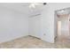 Bedroom featuring tile flooring, closet, and ensuite access at 2938 Foraker Way, Kissimmee, FL 34758