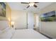 Comfortable bedroom with mounted TV and doorway leading to another room at 2980 Caribbean Soul Dr, Kissimmee, FL 34747