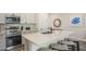 Stylish kitchen with modern appliances, a large island, and barstool seating at 2980 Caribbean Soul Dr, Kissimmee, FL 34747