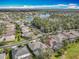 An elevated view showing a neighborhood surrounding a tranquil lake at 328 Hamrick Dr, Kissimmee, FL 34759