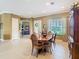 Spacious dining room featuring tile flooring, an elegant chandelier, and access to other living spaces at 328 Hamrick Dr, Kissimmee, FL 34759