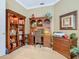 Home office with wood shelving, desk, and artwork at 328 Hamrick Dr, Kissimmee, FL 34759