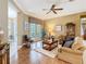 Living room with hardwood floors, neutral color palette, and natural light at 328 Hamrick Dr, Kissimmee, FL 34759