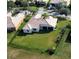 Aerial view of a well-maintained fenced backyard with lush green grass and mature landscaping at 4018 Navigator Way, Kissimmee, FL 34746