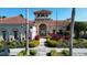 Community clubhouse featuring beautiful landscaping at 4018 Navigator Way, Kissimmee, FL 34746