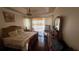 Comfortable main bedroom with a king bed, a dresser, and a large window at 4018 Navigator Way, Kissimmee, FL 34746