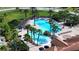 Stunning resort-style pool surrounded by swaying palms and ample lounging space at 4018 Navigator Way, Kissimmee, FL 34746