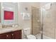 Bathroom featuring a glass door shower, granite countertops, and a view to an adjacent bedroom at 430 Novi Path, Kissimmee, FL 34747