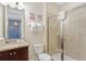 Bathroom featuring a glass door shower, granite countertops, and princess-themed wall decor at 430 Novi Path, Kissimmee, FL 34747