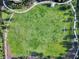 Aerial view of a soccer field with grass and a walking path at 430 Novi Path, Kissimmee, FL 34747