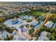 Aerial view of a community water park with pools, slides, and a splash pad surrounded by palm trees at 430 Novi Path, Kissimmee, FL 34747